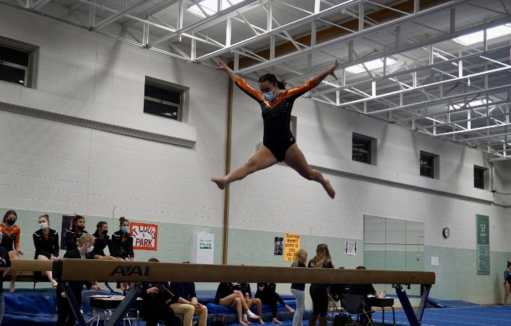Senior Giulia Ruffoli performs her routine during a meet Jan. 25. The gymnastics team was forced to miss practices and meets due to a COVID outbreak.