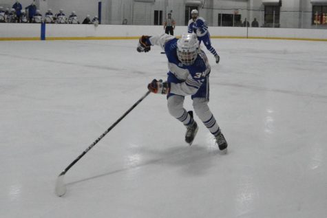 Sophomore Camryn Witham races after the puck against Woodbury Jan. 21. Park lost 2-0.