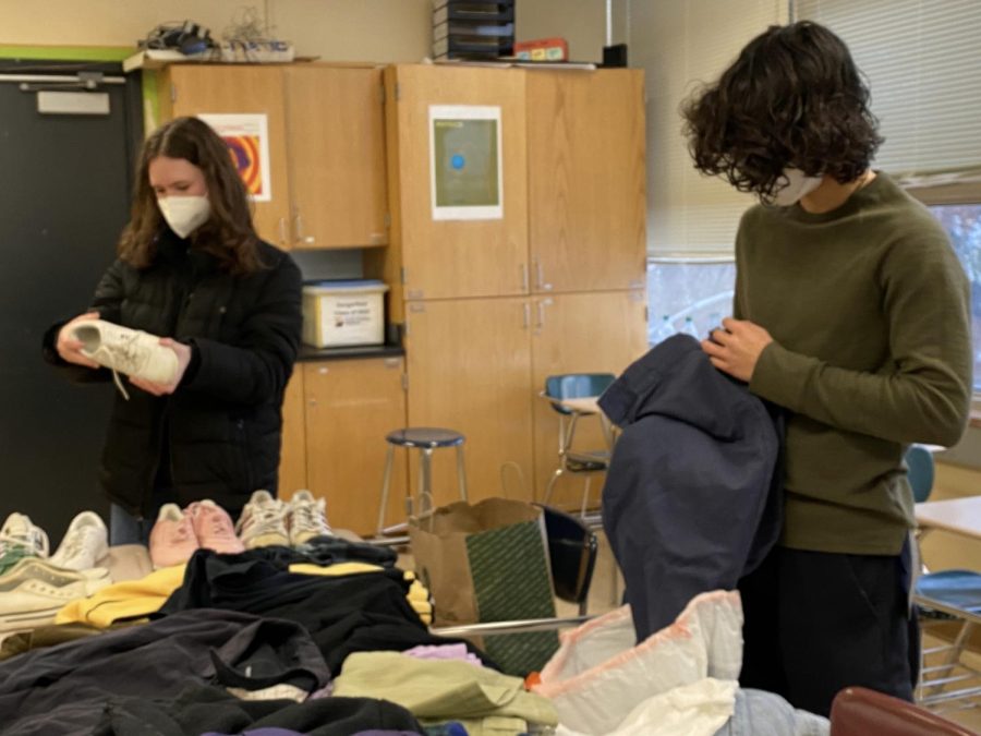 Juniors Keira Trill and Soline Mendez-Duffy unbox clothing donations during meeting. SLP Streetwear meets 3:30pm Wednesdays in A301.
