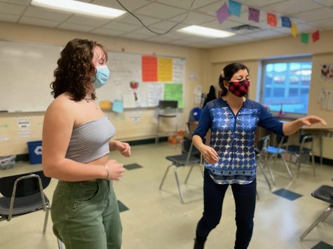 Junior Cece Jensen and Spanish club adviser Hanna Anderson dance together Jan. 20. Club members learned merengue, bachata and salsa. 

