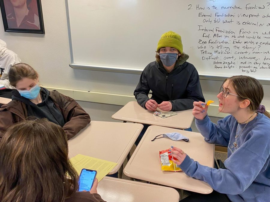 Juniors Izzy Nathan, Ruby Livon and Jonah Schmeig participate in a Jewish trivia game during the meeting January 6. Each Jewish Student Union meeting consists of various educational activities.