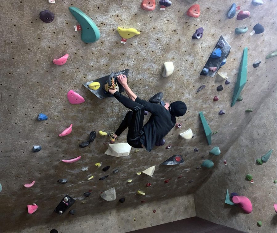 Wes Anderson climbs at Vertical Endeavors on Jan 12. Anderson is a part-time volunteer that judges climbing competitors.