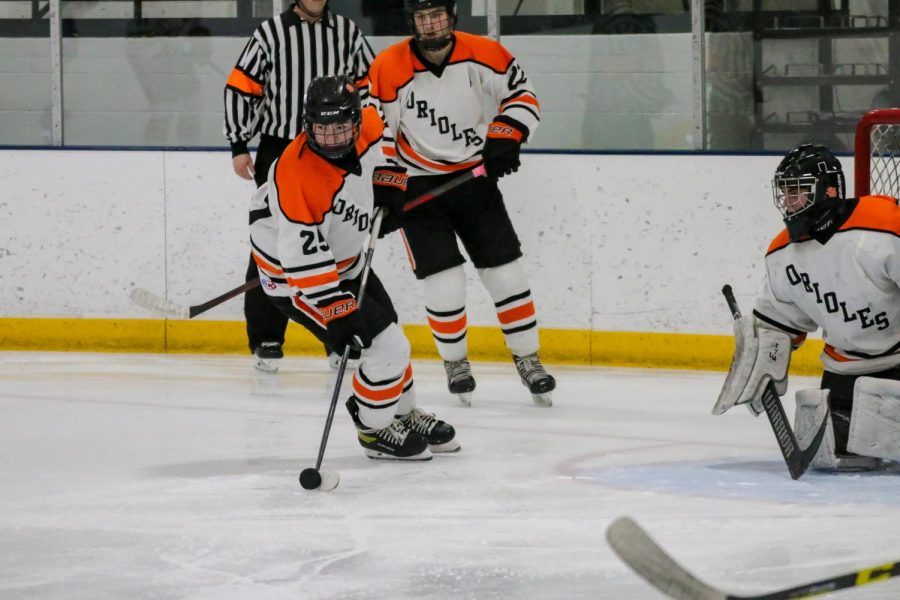 Sophomore Henry Shultz defends the puck from the goal. Parks next game is at 7 p.m. Thursday, Jan 13 at the St. Louis Park Outdoor Recreation Center.