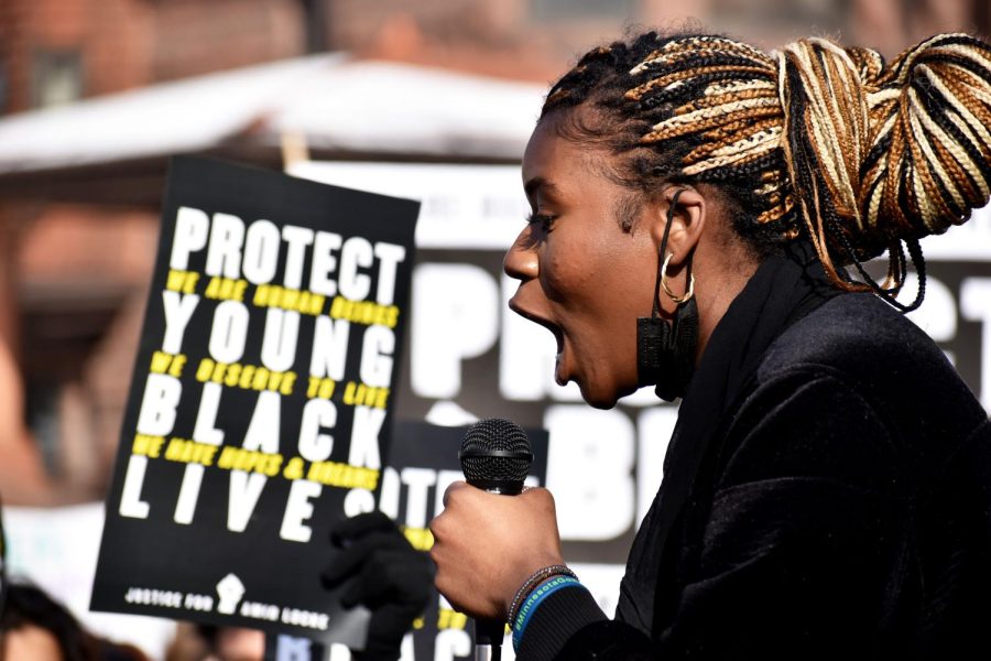 St. Paul Central High School senior Grace Mutombo leads a chant Feb. 8. Many protesters spoke about their experiences and feelings about police violence.