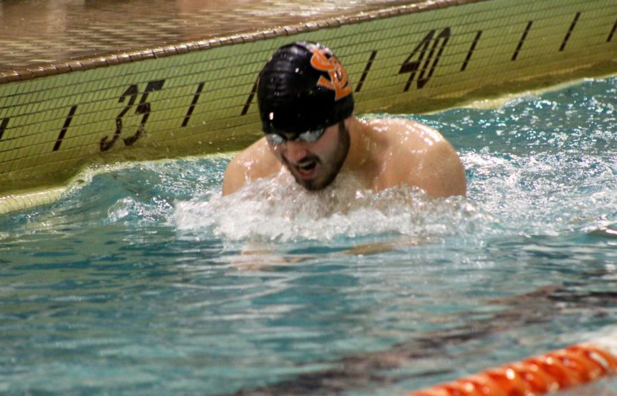 Senior captain Hero McKee swims the 200-individual Medley Feb. 8. Boys swimming will participate in sections Feb. 24.