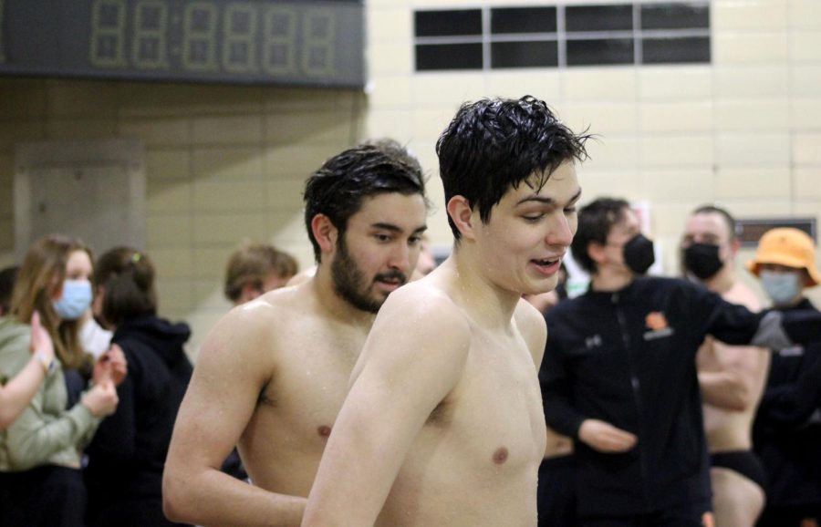 Seniors Hiro McKee and Zachary Nathan enjoy their final moments at the Park pool after taking a group photo Feb. 8. Families and friends in the crowd supported seniors.
