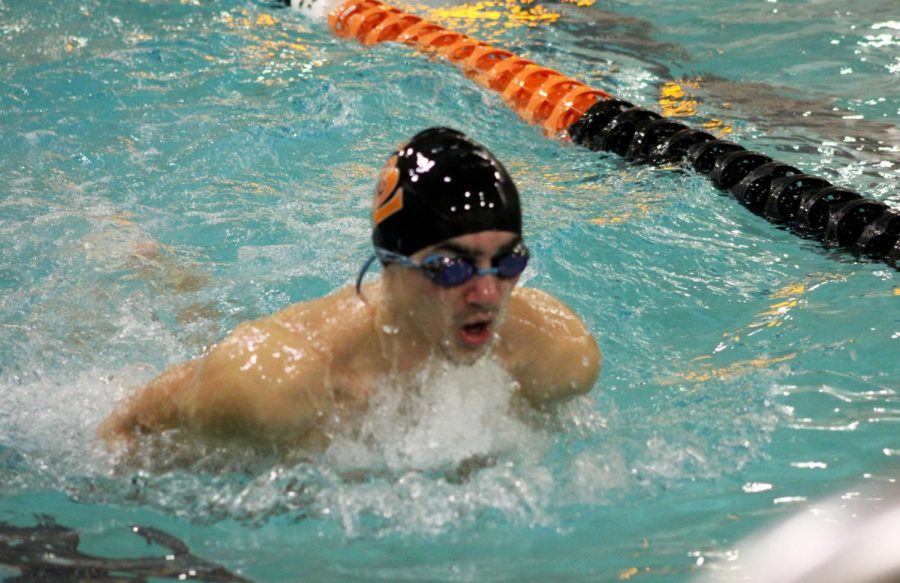 Harris Keekley swims the 200-Medley Relay. The senior swimmers were honored during senior night.