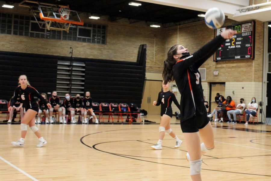Senior Elsa Bergland jumps above the net to spike the ball Sept. 29, 2021. Park girls' volleyball is now hosting volleyball clinics in the off-season.