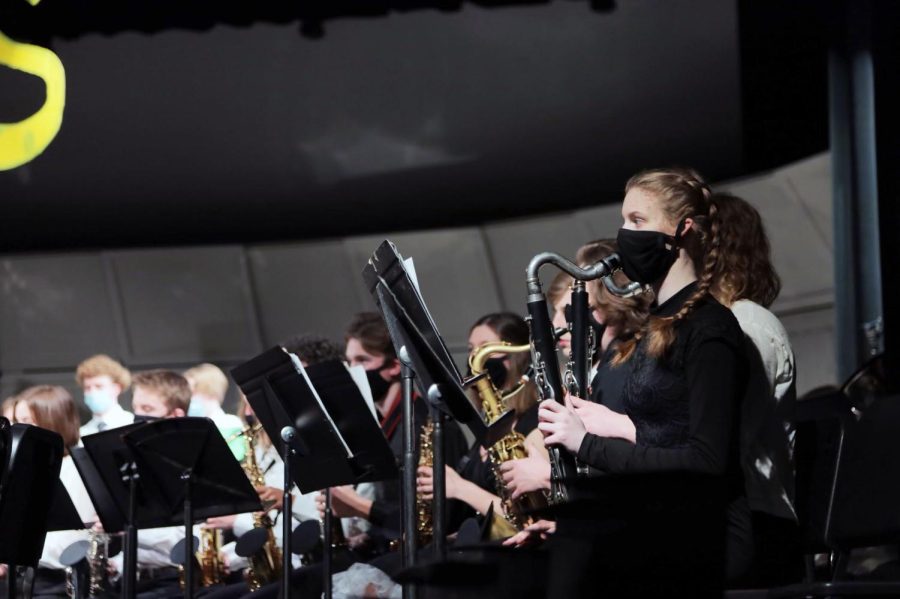 Junior Abby Baudhuin plays the bass clarinet.  Band performers were required to wear masks while preforming.