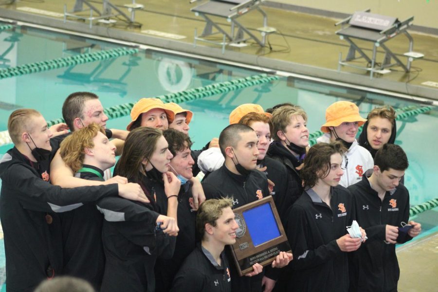 Boys swimming poses for a photo Feb. 26. Th e team placed second at Section finals. 