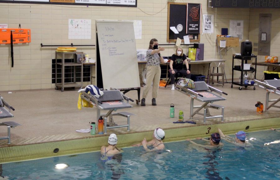 Coach+Carolyn+Guddal+instructs+swimmers+March+10.+This+is+Guddals+first+year+of+being+the+head+coach+for+girls+synchronized+swimming.+