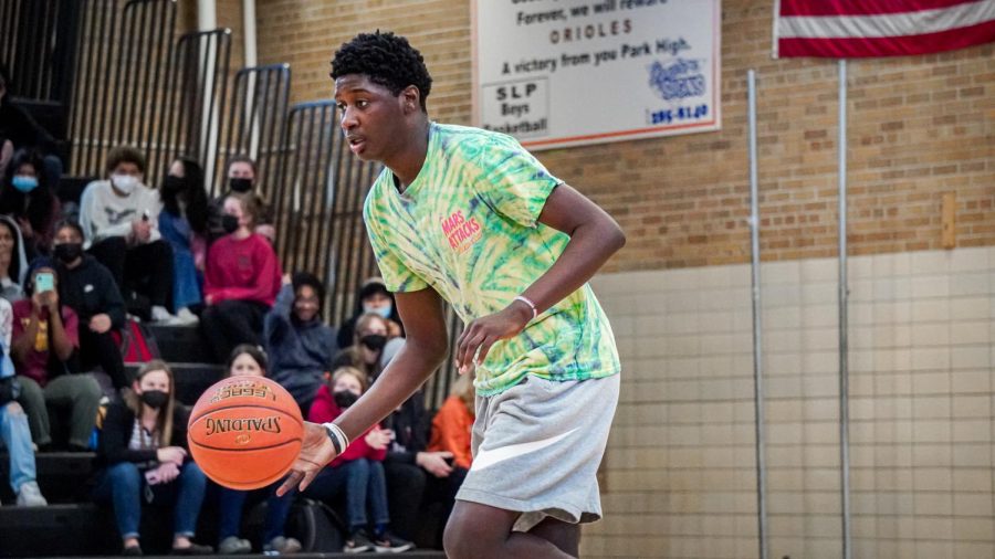 Junior Dmarion Triplett dribbles towards the basket to take a shot March 24. Students were encouraged to sign up to participate in the game.