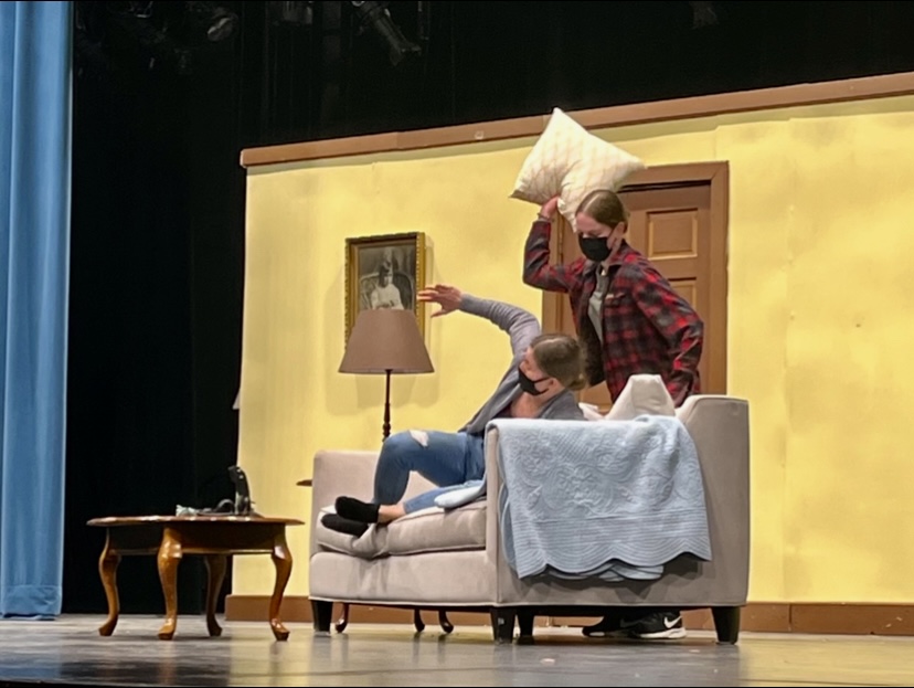 Freshman Karen Dworsky prepares to hit senior Louise Marshall with a pillow in a theater rehearsal April 20. Dworsky and Marshall will play a pair of sisters in Mutually Assured Destruction.