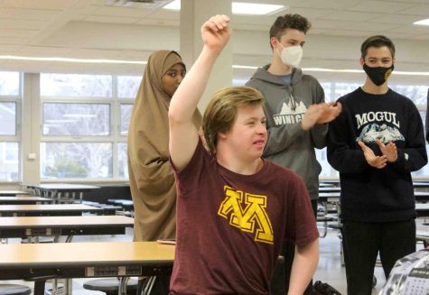 Junior Ben Duncan celebrates his team winning an activity during a By Your Side club meeting May 17. By Your Side finished their first in person year this school year.
