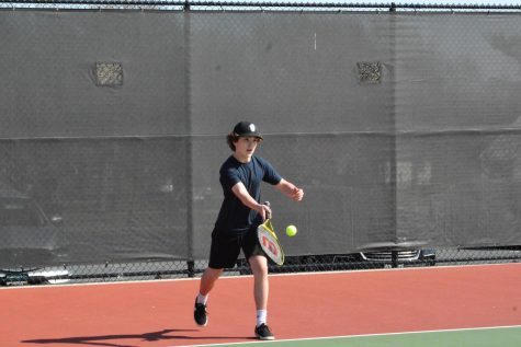 Sophomore Brennan Anderson gets ready to hit the ball. Boys tennis’ held a tournament fundraiser on May 7.