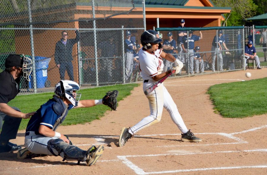 In his first at-bat, Senior Stanley Regguinti connects with a pitch against Chanhassen May 16. Regguinti helped Park extend its winning streak to 6 games.