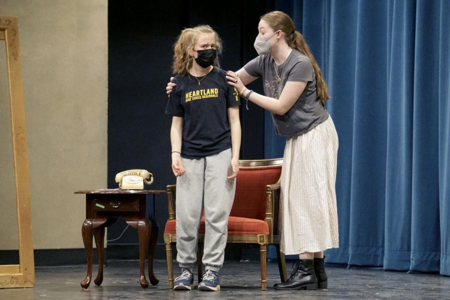 Senior Caroline Butler and freshman Sela Myers prepare for one last play. The thespian club performs in final act with Mutually Assured Destruction.