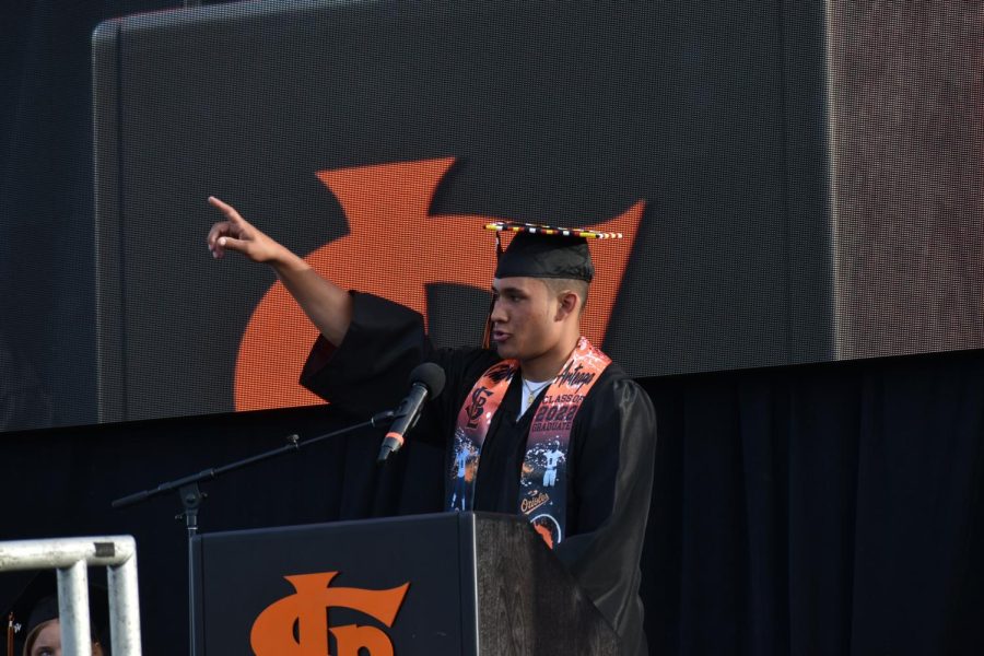 Senior Christian Arteaga gives a speech onstage June 7. Several student speakers were selected to introduce graduates and speak before commencement. 