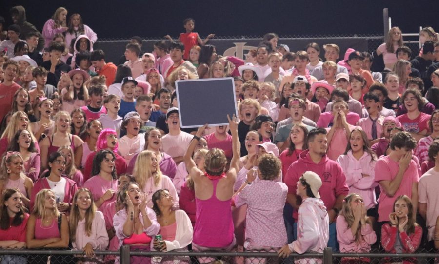 The class of 2023 led the student section in the Orioles battle against Two Rivers Sept. 16. The student dress code was pink-out — to support the Tackle Breast Cancer theme.
