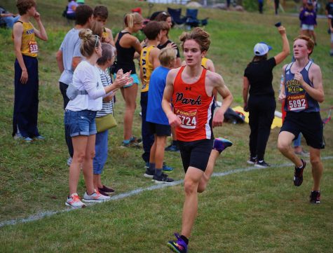 Paxon Myers sprints to the finish during the cross country meet at Gale Woods farm on Oct. 4th. Myers finished first for the Orioles and 37th overall in the race.
