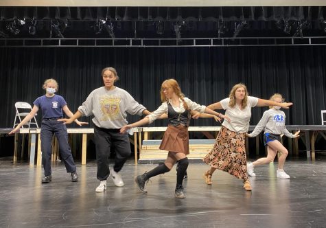 Theater cast recites choreography for the Cell Block Tango for the new production of “Chicago: Teen Edition.”