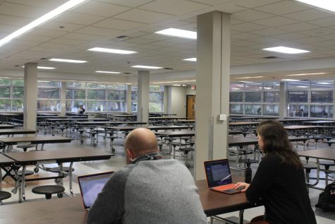 Advisors monitor after-school detention in the cafeteria Oct. 13. Students are assigned to a detention after multiple unexcused absences or tardies. 