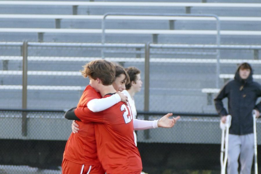 Junior Bjorn Bleske and Sophomore Tyler Puenties hug after Park earns a goal Oct. 6. Park went into two overtimes and lost to the Spartans 3-2.