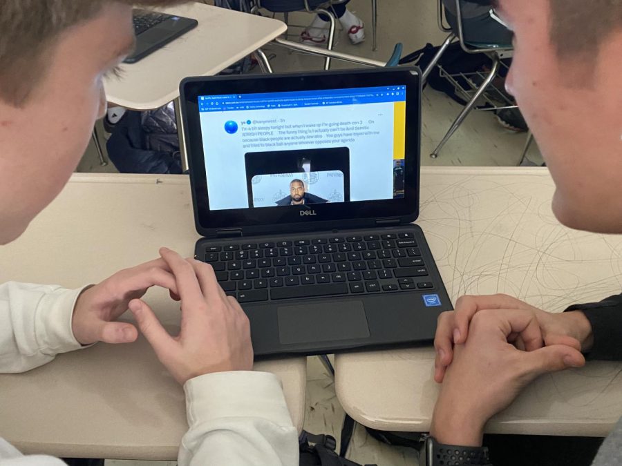 Juniors Javier Schimming and Brady Shultz view and discuss anti-Semitic tweet made by rapper Kanye West Oct. 8. The tweet sparked much discussion all over the internet