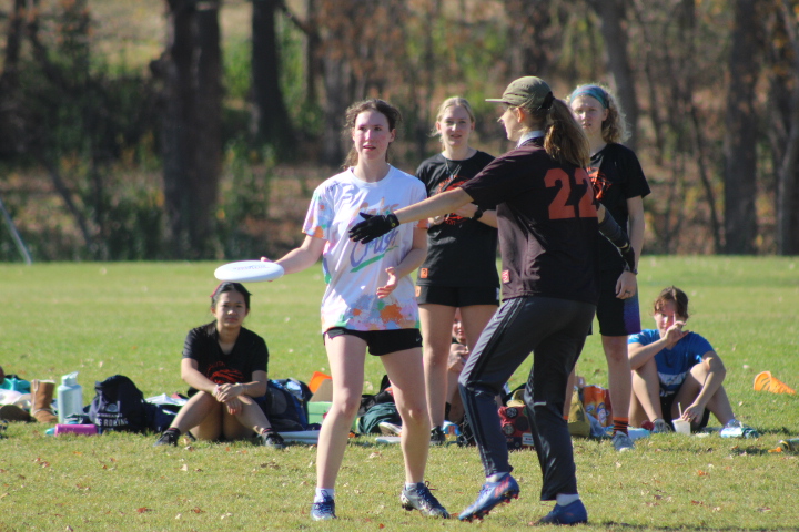 Senior Kiera Trill throws the frisbee to a teammate at the Crushtober tournament Oct. 30. The annual Crushtober event consists of several different schools competing against each other. 