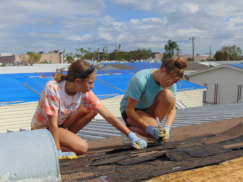 Freshman Sophie Miller and Claire Williams remove the remaining shingles from a roof Oct. 20. Family friends and I went to Florida to help clean up after Hurricane Ian. 