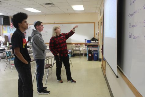 Math team supervisor Kristen Johnson talks with mathletes to prepare for their meet Nov. 28. Math team meets every Monday after school.