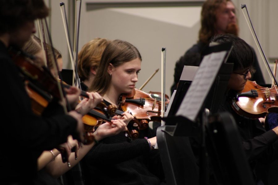Freshman Audrey Martin plays her violin at the orchestra concert December 15. This was their last concert before winter break.