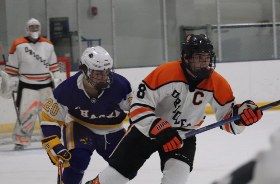 Senior Teddy Dahlin races after the puck against the Hawks Dec. 1. Park took on Chaska in a defensive game Friday night. 