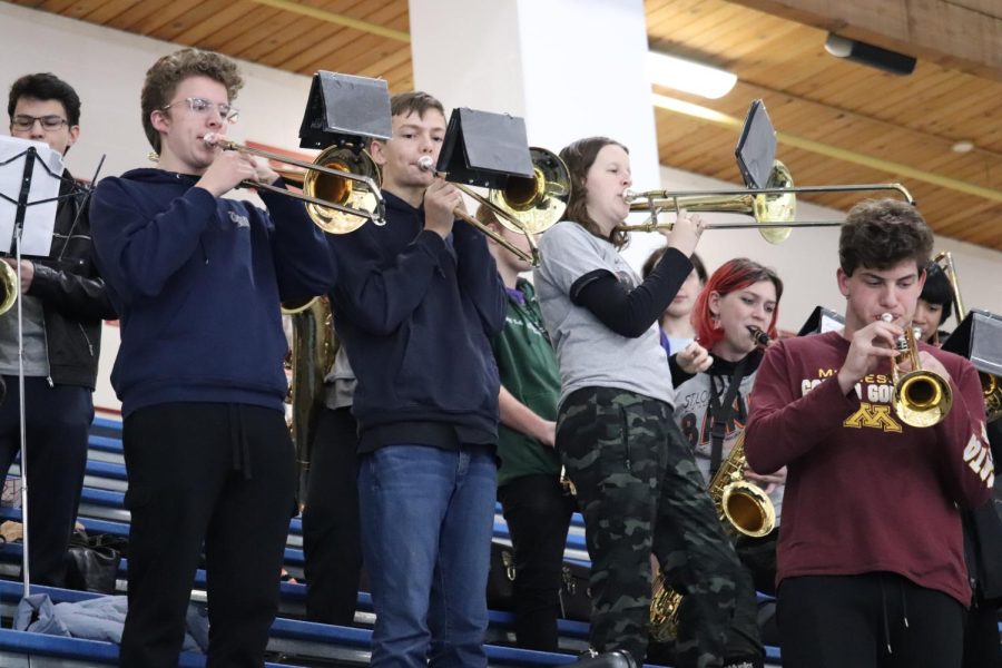 Band+kids+play+trombone+during+the+hockey+game+Dec.+1.+Boys+hockey+lost+to+Chaska+1-5.