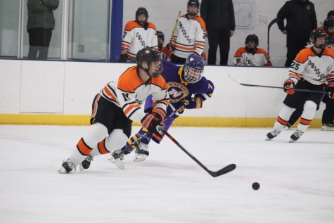 Junior Henry Schrader skates the puck towards the Orioles offensive zone Dec. 9. Park battled Waconia at home, Friday night. 
