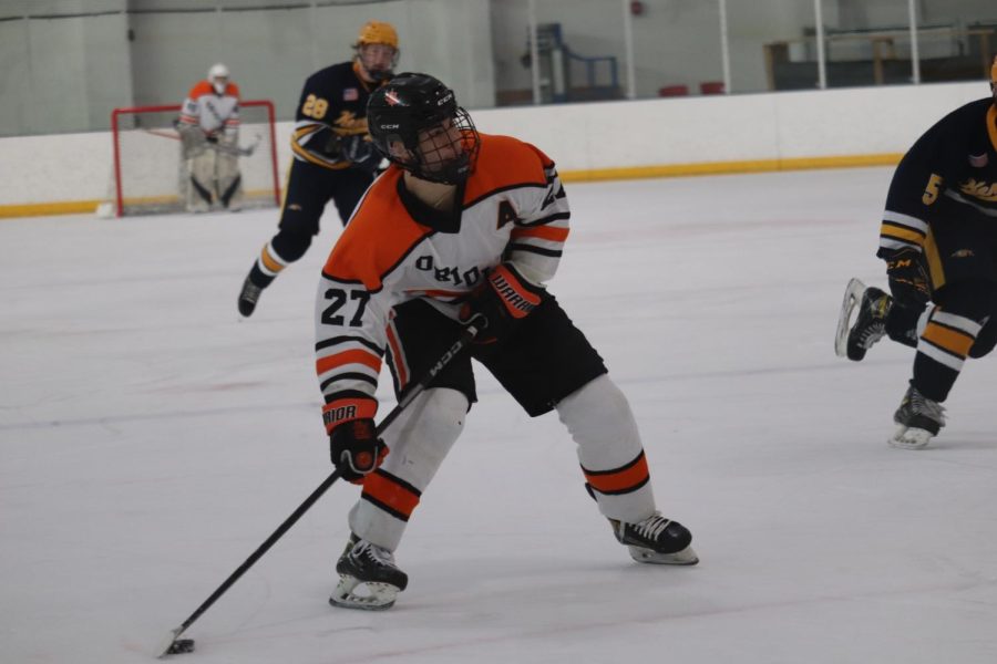 Senior Cole Taylor skates the puck down the ice Jan. 28. Park defeated Kennedy 9-1 Saturday. 