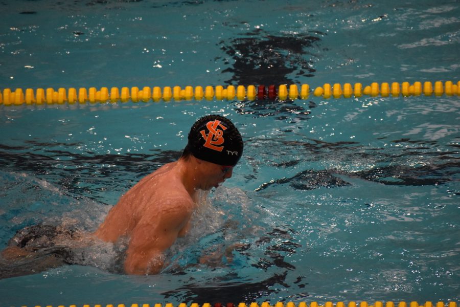 Senior Miles Nordling swims in one of his races Saturday. Nordling won both of his races Jan. 7.