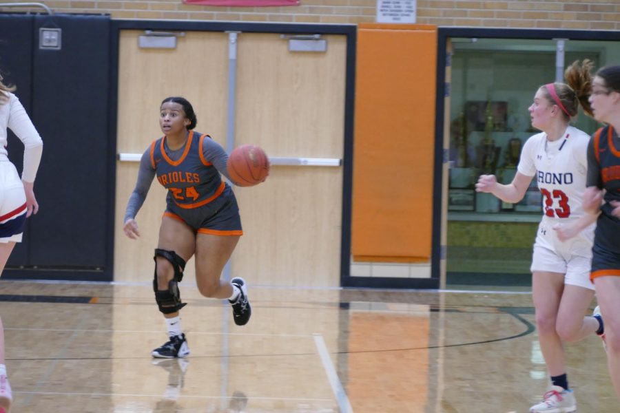 Senior Stacy Spates runs the ball down the court Jan. 10. Orono lost to park by six points.