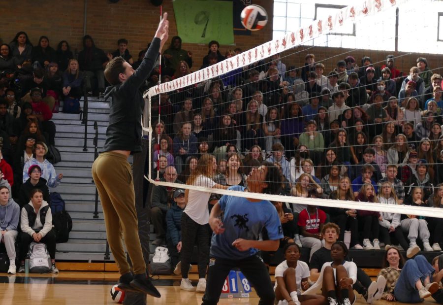 Senior Ryan duSaire watches in awe, as teacher David Pirrie blocks a set Feb. 10. Park had a staff vs. student volleyball game during SnoDaze week