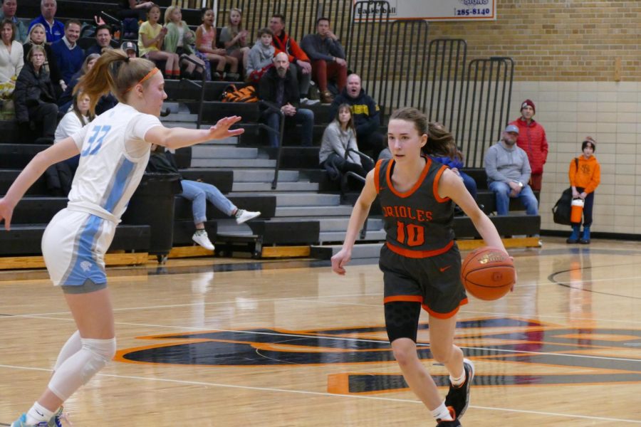 Senior Lauren Pawlynshyn dribbles the ball down the court Feb. 24. Their first game in sections is March 1 against Cooper. 