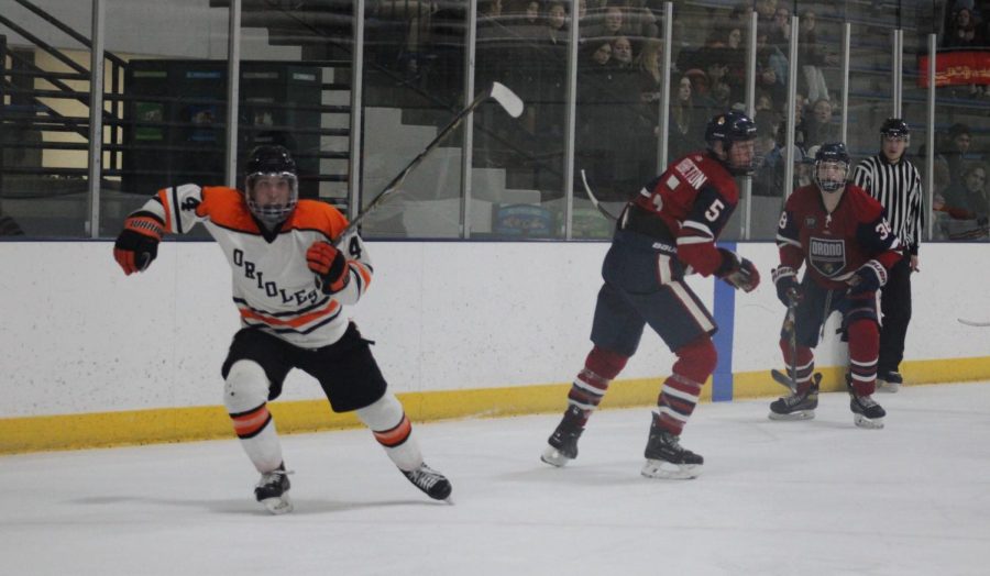 Junior Griffin Krone skates among his opponents. The Orioles took a 3-0 loss Feb. 2  at the St. Louis Park Rec Center.