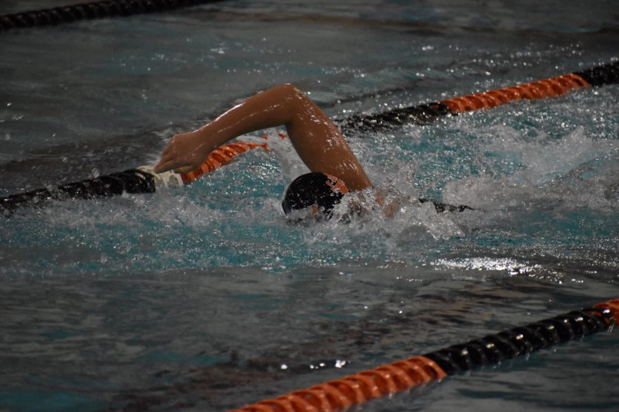 Seventh-grader Axel Smith swims the last leg of the JV 400 freestyle relay. The team went up against the Waconia Wildcats Feb. 9.