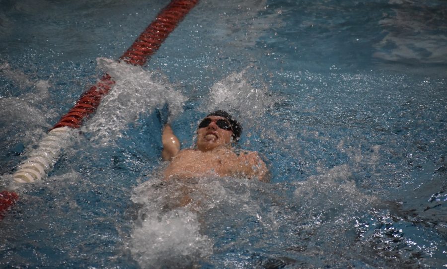 Junior Henry Salita swims the 100 back in the 200 medley relay. The boys lost 95-77 Feb. 2 to Benilde-St. Margarets.