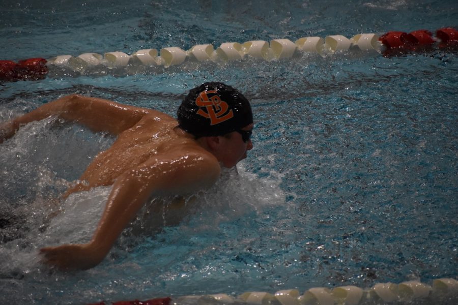 Sophomore Finn Berry swims the 200 IM for the boys team on Feb. 2. The boys went up against Benilde-St. Margarets.