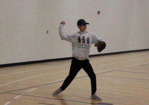 Freshman Owen Twedten prepares to throw a baseball Feb. 27. Baseball continues captains practices before the season.
