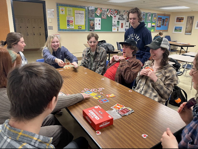 Senior Wes Anderson laughs with friends during the Climbing Club meeting March 2. The club plays “Crabs” and other games to bond during their meetings.