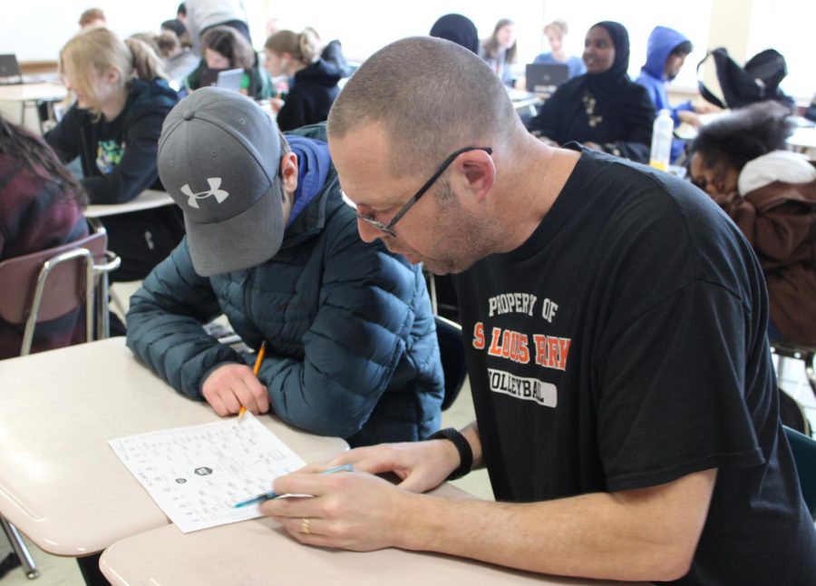 Park math teacher Chad Austad works with students on their March Madness brackets. Austad holds his annual March Madness bracket competition, as the tournament kicks off in March 2023. 
