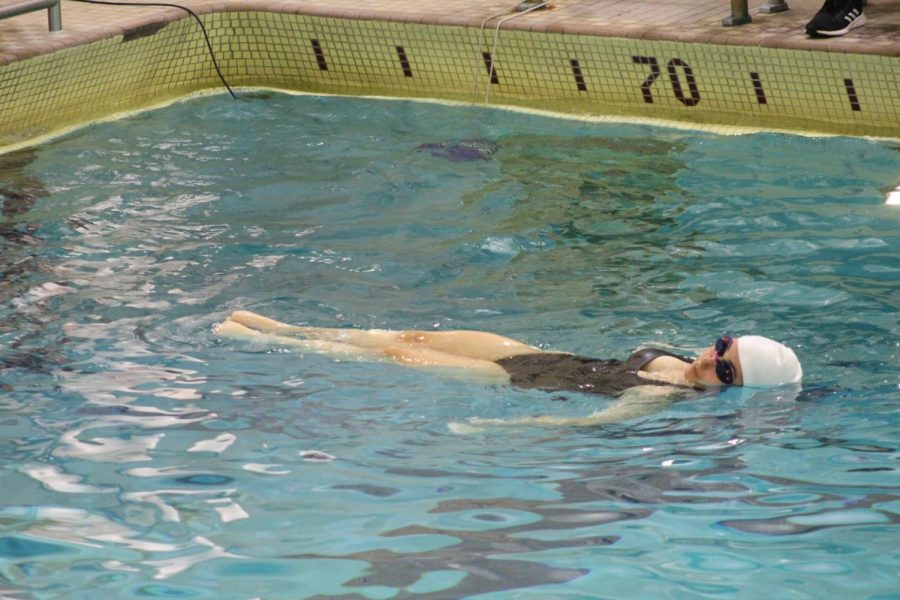Junior Katherine Velez performs her barracuda figure March 23. Parks synchro team ended the meet against Richfield with a score of 22-7 last Thursday.