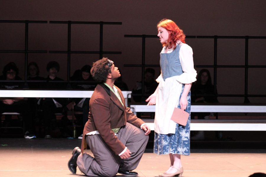Gwen Rockler-Gladen (Belle) sings onstage March 18. She sings A Change in Me to her father Maurice, played by Isaiah Brown. 