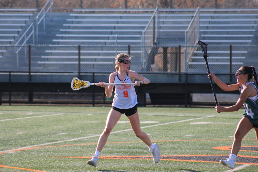 Sophomore Ailish Fitzpatrick prepares to pass in hopes to score a goal April 12. Park’s girls’ lacrosse began with tryouts and a win during their first scrimmage of the season.